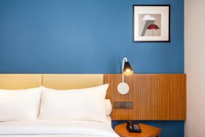 Voodi või voodid majutusasutuse ibis Styles Bogor Pajajaran toas