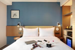 Voodi või voodid majutusasutuse ibis Styles Bogor Pajajaran toas