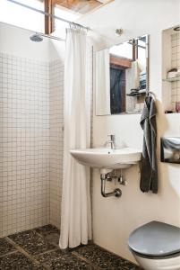 a bathroom with a sink and a toilet and a shower at Family Time At Sea Air Nature By Ebeltoft Bay in Ebeltoft +31 photos