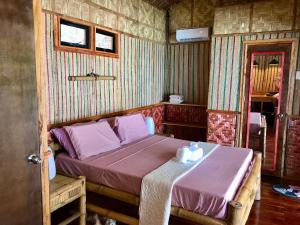 Camotes Cay Hideaway客房内的一张或多张床位