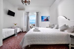 Postel nebo postele na pokoji v ubytování Hotel Nazos 1