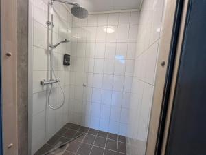 a bathroom with a shower with a glass door at Åndalsnes house in Åndalsnes