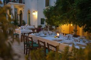 a table set up for a meal in a restaurant at Masseria Il Frantoio in Ostuni