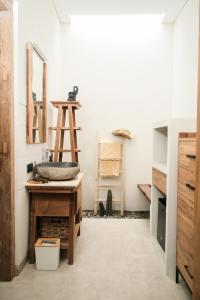 a bathroom with a sink and a mirror on a counter at Casa Benna - Salatiga in Salatiga +58 photos
