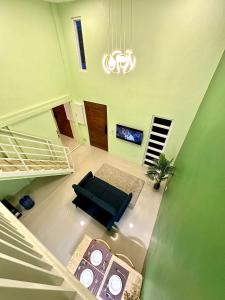 Ένα ή περισσότερα κρεβάτια σε δωμάτιο στο Dolack Loft Stay Gensan
