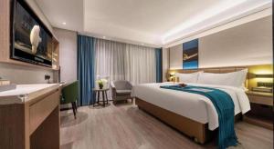 Ein Bett oder Betten in einem Zimmer der Unterkunft Nanning Prince Hotel