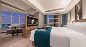 Ein Bett oder Betten in einem Zimmer der Unterkunft Nanning Prince Hotel