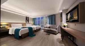 Ein Bett oder Betten in einem Zimmer der Unterkunft Nanning Prince Hotel
