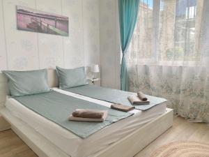 A bed or beds in a room at Apartments in complex ATIA RESORT