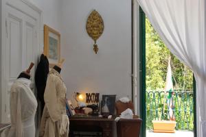 two people in robes standing in a room with a window at Masseria Il Frantoio in Ostuni
