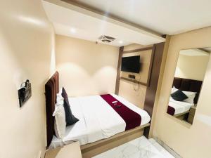 Postel nebo postele na pokoji v ubytování Hotel Dolphin Residency