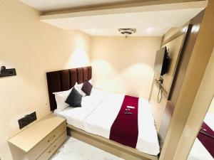 Postel nebo postele na pokoji v ubytování Hotel Dolphin Residency