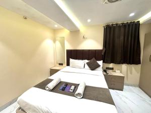 Postel nebo postele na pokoji v ubytování Hotel Dolphin Residency