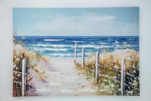 a painting of a path to the beach at Apartament Lipowa 26 in Gliwice