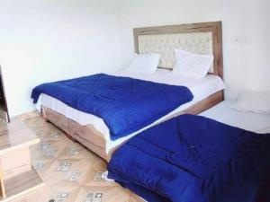 Letto o letti in una camera di Shiv Shankar Resort