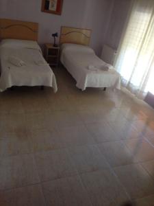 Postel nebo postele na pokoji v ubytování Hostal Jose Luis