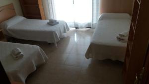 Postel nebo postele na pokoji v ubytování Hostal Jose Luis