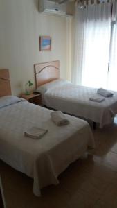 Postel nebo postele na pokoji v ubytování Hostal Jose Luis