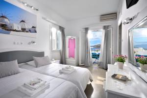 Postel nebo postele na pokoji v ubytování Hotel Nazos
