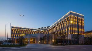 a large office building with a lot of windows at Xi'an Airport Hotel in Xianyang