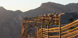 a view of a mountain with buildings on it at Alila Jabal Akhdar in Al Khuţaym