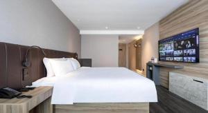 Postel nebo postele na pokoji v ubytování Hanting Hotel Shanghai Jinqiao International Square