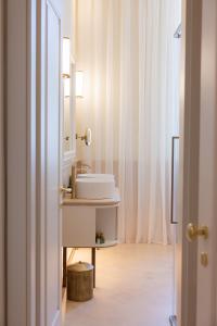 a bathroom with a sink and a mirror at Hotel Belvedere in Forte dei Marmi