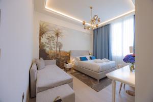 a living room with a bed and a couch at Hotel Belvedere in Forte dei Marmi