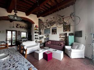 a living room with a bike hanging on the wall at Eroico sul Mare in Portoferraio