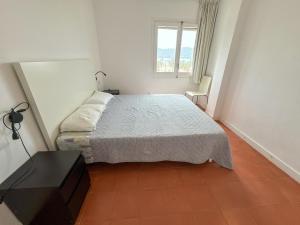 A bed or beds in a room at RHODAS 16