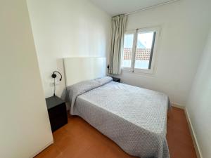 A bed or beds in a room at RHODAS 16