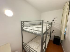 A bed or beds in a room at RHODAS 16