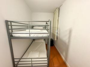 A bed or beds in a room at RHODAS 16