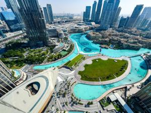 an aerial view of a city with tall buildings at GRANDE RESIDENCES with a direct Burj Khalifa view and Private Fountain Show at 38th floor with DXB AIRPORT VIP Shuttle in Dubai