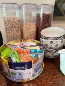 a container of oats and other food items on a table at Arduinna's Nest B&B in Neufchâteau