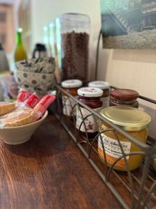 a shelf with a bunch of food on a table at Arduinna's Nest B&B in Neufchâteau