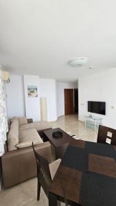 a living room with a couch and a tv at PSB Apartments in Etara 2 & 3 Complex Sveti Vlas in Sveti Vlas +27 photos