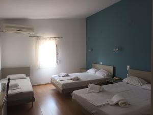 Ένα ή περισσότερα κρεβάτια σε δωμάτιο στο Hotel THERMOPULES