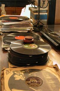 a stack of records sitting on top of a table at Masseria Il Frantoio in Ostuni