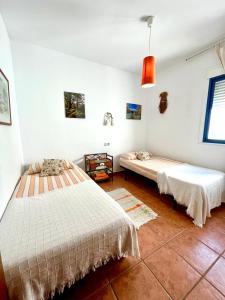 Łóżko lub łóżka w pokoju w obiekcie Apartamento Del Mar Las Negras