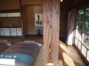 เตียงในห้องที่ 五島列島おぢか島 古民家ステイ