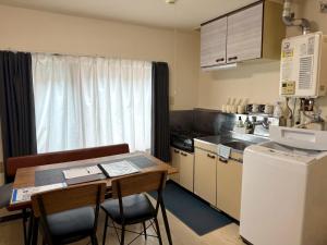 O bucătărie sau chicinetă la KIYAZA River Sapporo