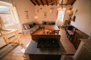 a living room with a couch and a table at Alloro casa storica in Arcola +17 photos