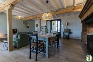 a dining room and living room with a table and chairs at Gîte la selve d'autan in Caraman +19 photos