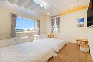 Giường trong phòng chung tại Lu Dao Homestay