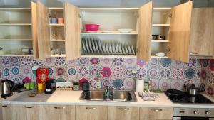 a kitchen with a sink and a counter top at Mami in Malia
