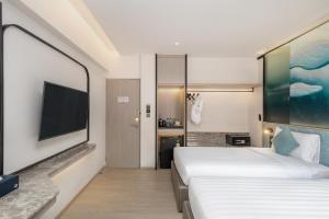 Postel nebo postele na pokoji v ubytování Cloudotel Walking Street Pattaya