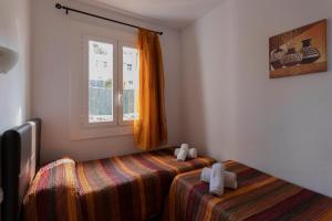 Ένα ή περισσότερα κρεβάτια σε δωμάτιο στο Villas 84 Est & Oest, Son Bou By MENORCARENTALS +9 φωτογραφίες