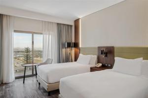Doubletree By Hilton Addis Ababa Airport客房内的一张或多张床位
