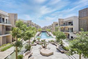 an aerial view of an apartment complex with a swimming pool at Doubletree By Hilton Mangroovy El Gouna Resort in Hurghada